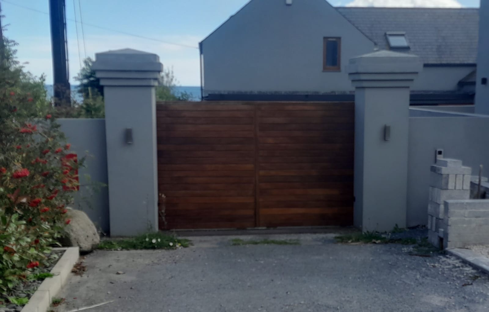 Electronic Gate Pillars On Luxury Home image